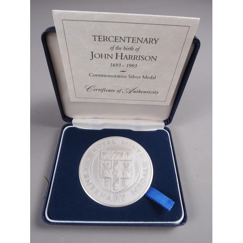 264 - A Royal Mint silver medallion, commemorating the Tercentenary of the birth of John Harrison, and two... 