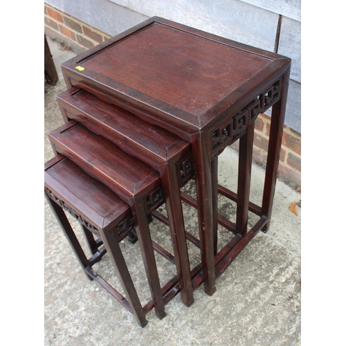 368 - A nest of four Chinese carved rosewood occasional tables, largest 17 1/2