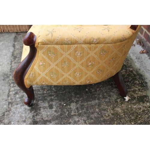 419 - A Victorian mahogany showframe button back armchair, upholstered in a gold floral fabric, and a matc... 