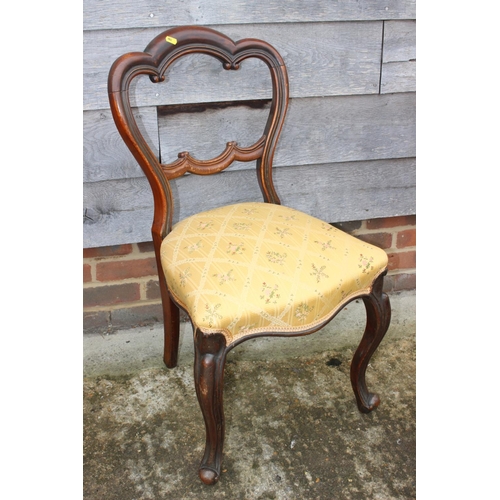 419 - A Victorian mahogany showframe button back armchair, upholstered in a gold floral fabric, and a matc... 