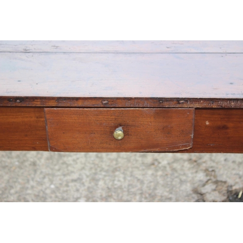 438 - An antique French cherrywood farmhouse table, fitted one drawer, on turned supports, 66