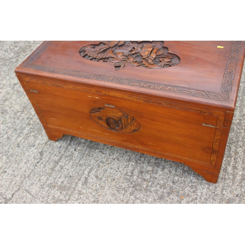 480 - A Chinese carved camphor wood chest, on bracket feet, 37