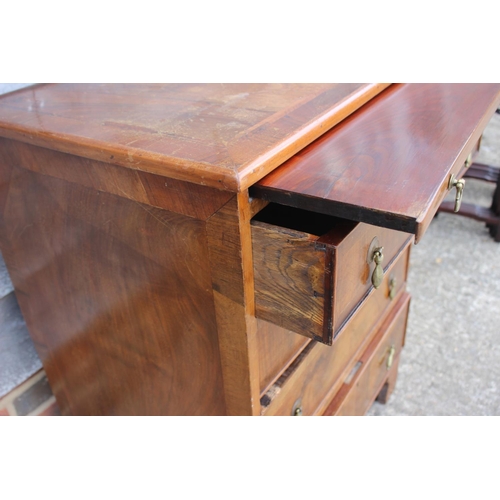 481 - A bachelor's figured walnut and banded chest of four drawers, on bracket feet, 24