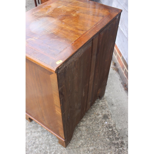 481 - A bachelor's figured walnut and banded chest of four drawers, on bracket feet, 24