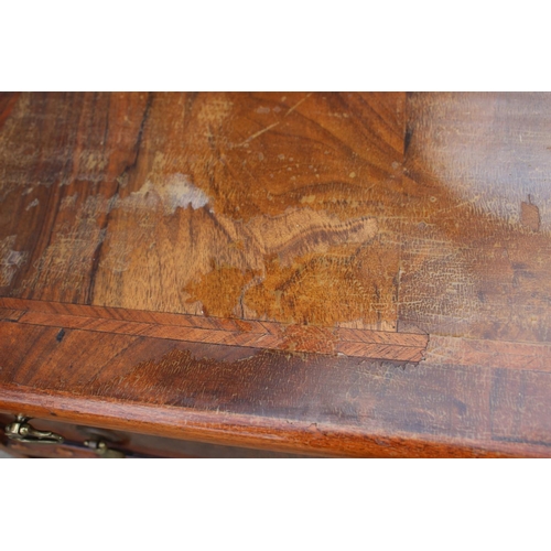 481 - A bachelor's figured walnut and banded chest of four drawers, on bracket feet, 24