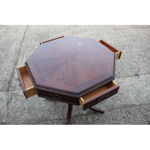 492 - A mahogany octagonal top table, fitted four drawers, on turned column and quadruple splay support, 2... 