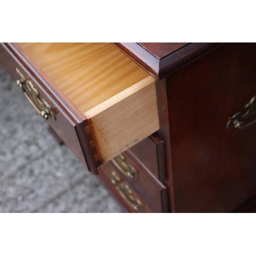 499 - A Brights of Nettlebed mahogany chest of four drawers, on bracket feet, 17