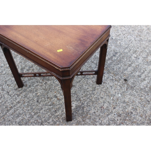 500 - A walnut occasional table, on square taper supports, 21