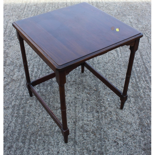 500 - A walnut occasional table, on square taper supports, 21