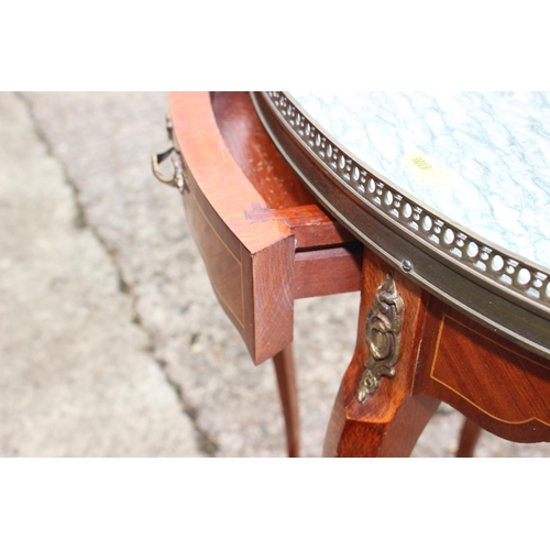 523 - A Louis XVI design mahogany and satinwood banded oval marble top gallery table, on cabriole supports... 