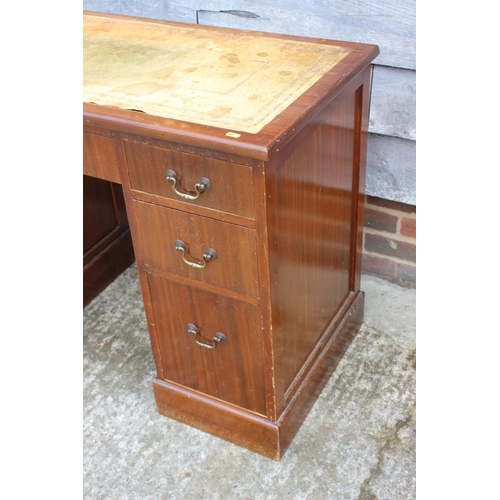 524 - A sapele mahogany double pedestal desk with cream leather lined top, fitted seven drawers, 41 1/2