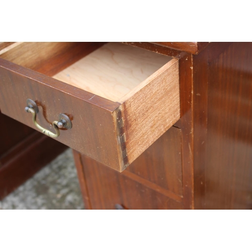 524 - A sapele mahogany double pedestal desk with cream leather lined top, fitted seven drawers, 41 1/2