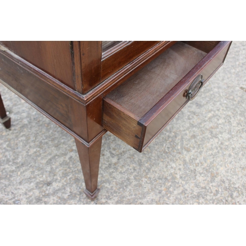 532 - A mahogany side cabinet enclosed two lattice glazed doors over two drawers, on square taper supports... 