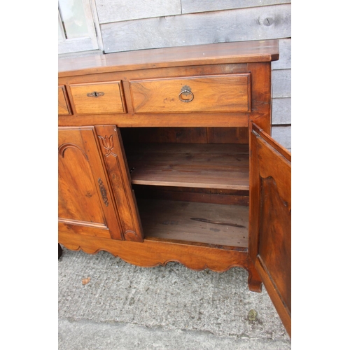 577 - A French walnut side cabinet, fitted two long and one short drawer over two cupboards, on cabriole s... 