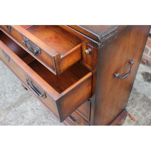 578 - A bachelor's Brights of Nettlebed polished as mahogany fold-over top chest of four long graduated dr... 