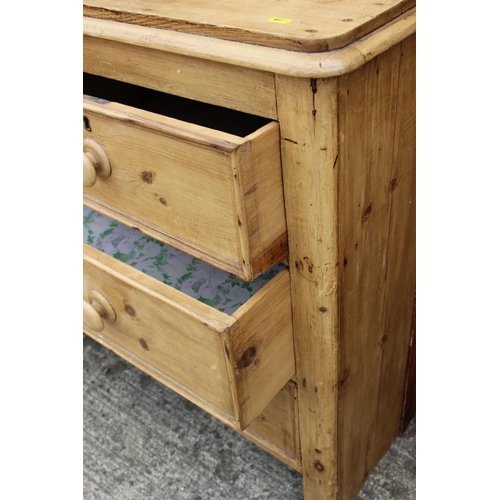 598 - A 19th century waxed pine chest, fitted two short and two long drawers, on end supports, 46