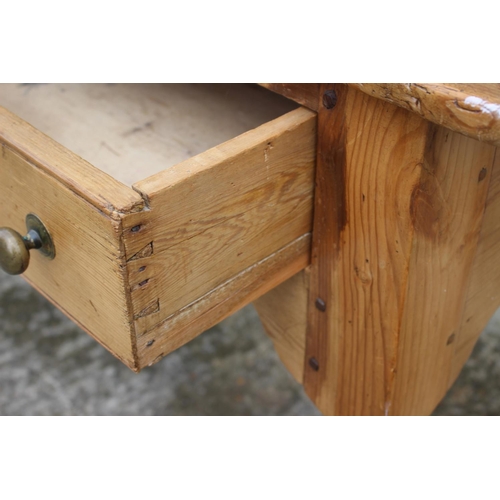 601 - A 19th century waxed pine dresser base, fitted three drawers, on turned supports, 60