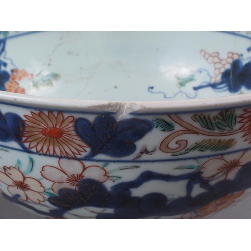 67 - Two Chinese Imari pattern bowls (damages) and a pair of Japanese figures, 8