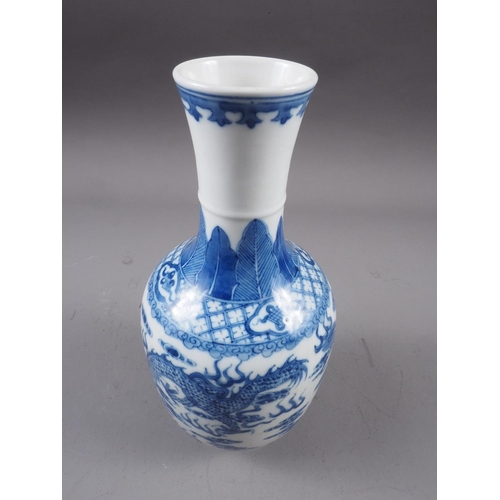 72 - A Chinese blue and white baluster two-handled vase, decorated mythical beasts and clouds with four-c... 