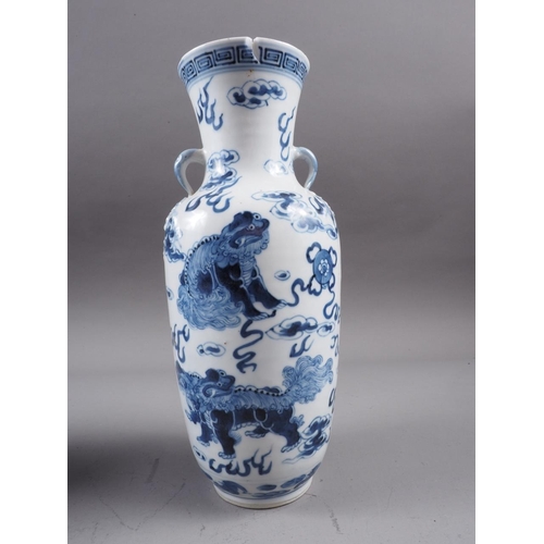 72 - A Chinese blue and white baluster two-handled vase, decorated mythical beasts and clouds with four-c... 