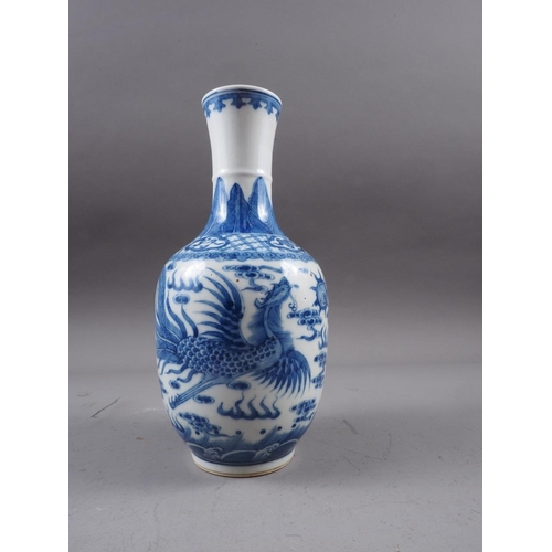 72 - A Chinese blue and white baluster two-handled vase, decorated mythical beasts and clouds with four-c... 