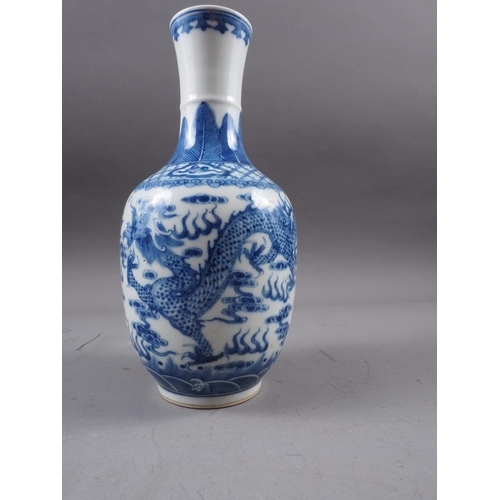 72 - A Chinese blue and white baluster two-handled vase, decorated mythical beasts and clouds with four-c... 