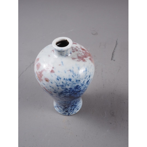 79 - A Chinese meiping vase, decorated blue and iron oxide sprays, 3 1/4