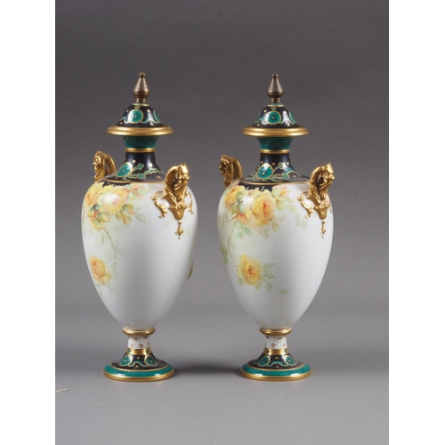 8 - A pair of Royal Crown Derby baluster pedestal two-handled vases and covers with floral decoration an... 