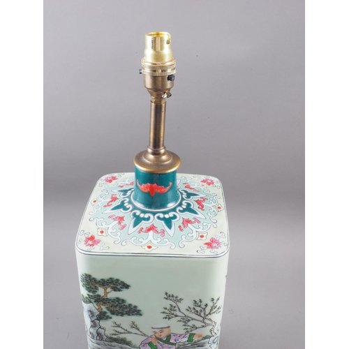 81 - A Chinese porcelain square-section lamp base, decorated children playing, on hardwood base, 22