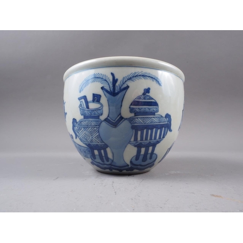 83 - A Chinese blue and white jardiniere, decorated precious objects, 4