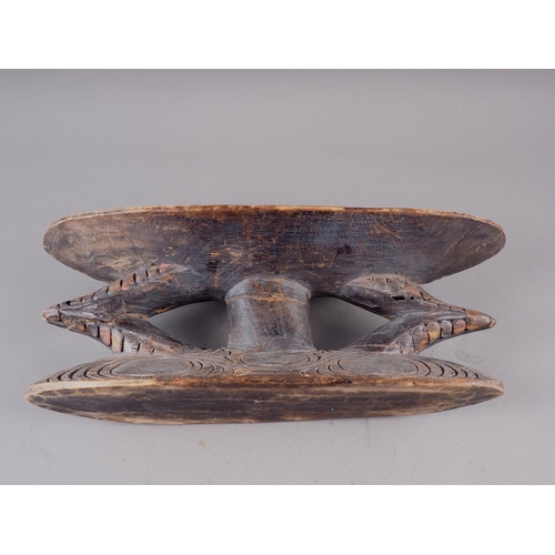 150 - A central African carved and painted wooden head rest, 17 1/2