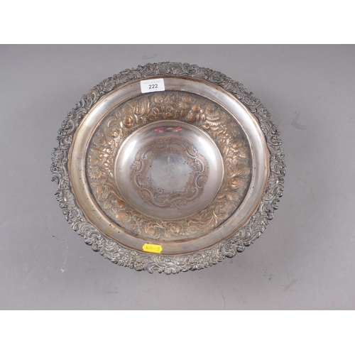 222 - A 19th century pedestal dish with embossed scrolled and foliate decoration, engraved with a heraldic... 