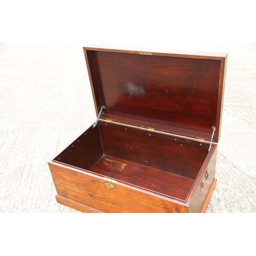 478 - A teak trunk with brass side clips, 34