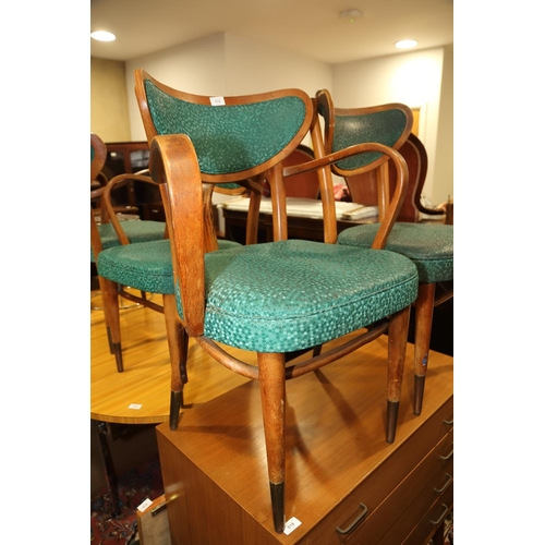 512 - A set of four plywood and bentwood armchairs, upholstered in a green mottled vinyl, on tapered and b... 