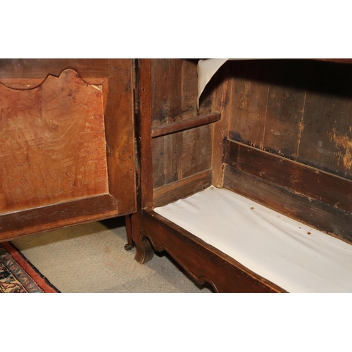 516 - A Continental oak sideboard, fitted three drawers over two cupboards with fielded panels, on cabriol... 