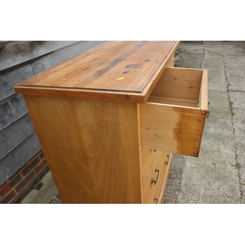 376 - A waxed pine chest of two short and three long drawers, on a block base, 37