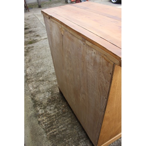 376 - A waxed pine chest of two short and three long drawers, on a block base, 37