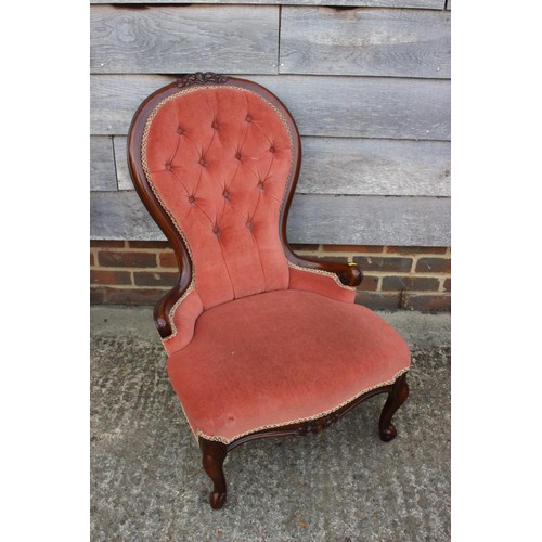 365 - A carved and polished as walnut open armchair, button upholstered in a salmon velour and a companion... 