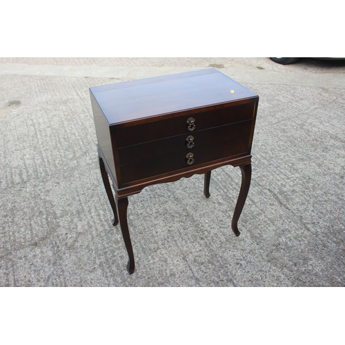 269 - A Community silver plate part table canteen, in mahogany three drawer, on cabriole supports