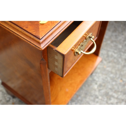 453 - A burr walnut bedside cabinet, fitted two drawers over a shelf, on bracket feet, 17 1/2