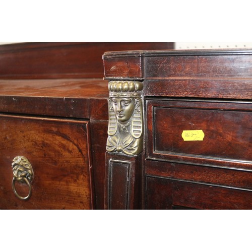 391 - A Regency mahogany and brass mounted drop centre double pedestal sideboard, fitted three drawers and... 