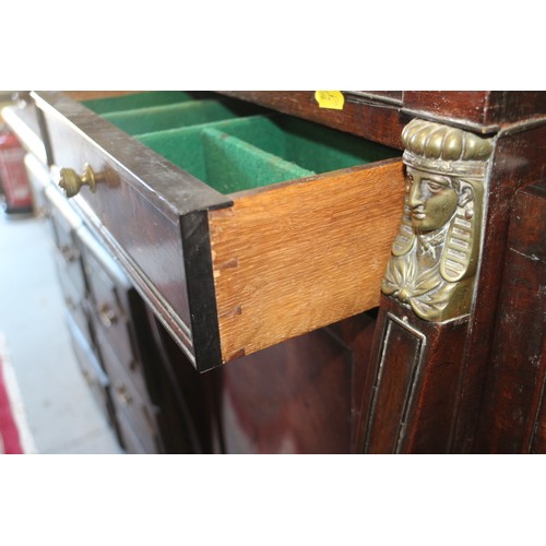 391 - A Regency mahogany and brass mounted drop centre double pedestal sideboard, fitted three drawers and... 