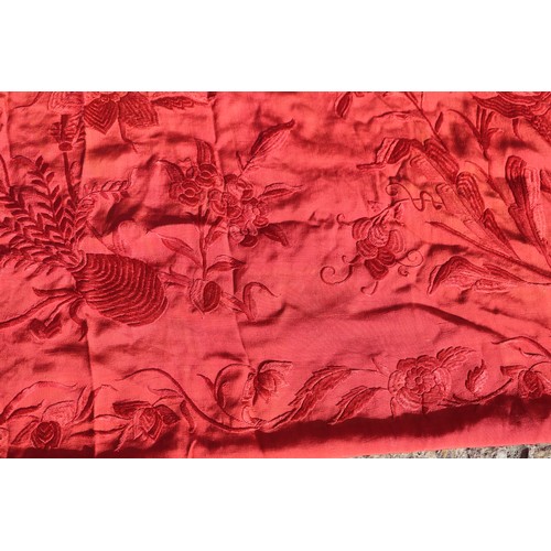 170 - An early 20th century red silk shawl with embroidery and tassel decoration, 64