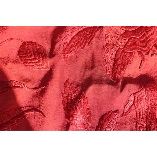 170 - An early 20th century red silk shawl with embroidery and tassel decoration, 64