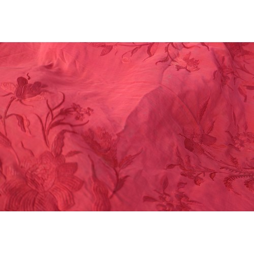 170 - An early 20th century red silk shawl with embroidery and tassel decoration, 64