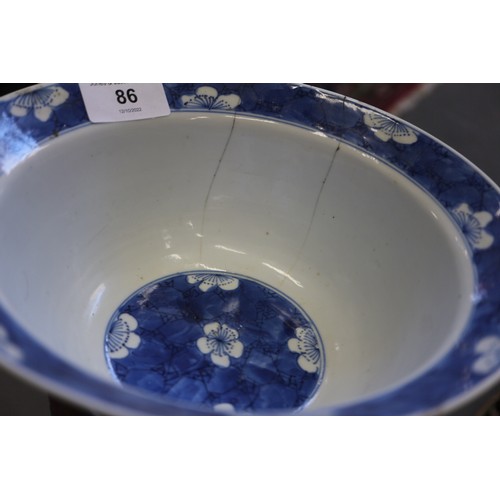 86 - A Chinese blue and white bowl with floral decoration and six-character mark to base, 8