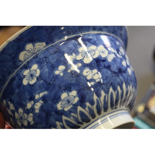 86 - A Chinese blue and white bowl with floral decoration and six-character mark to base, 8