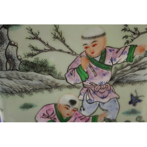 81 - A Chinese porcelain square-section lamp base, decorated children playing, on hardwood base, 22