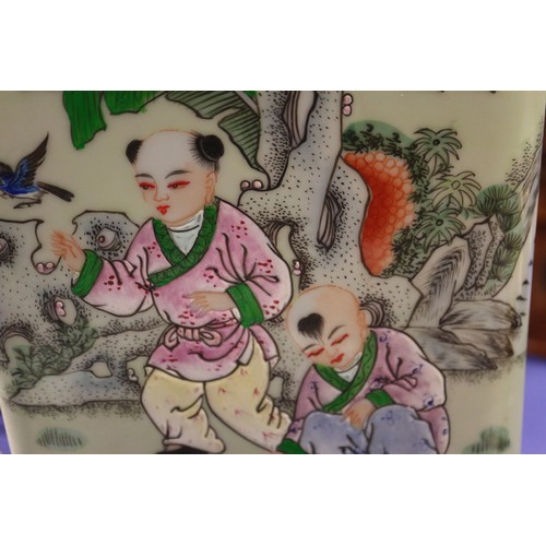 81 - A Chinese porcelain square-section lamp base, decorated children playing, on hardwood base, 22