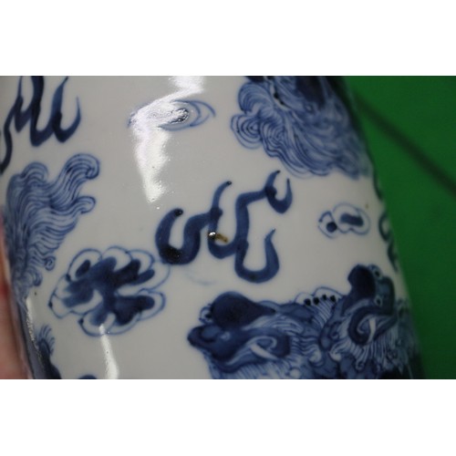 72 - A Chinese blue and white baluster two-handled vase, decorated mythical beasts and clouds with four-c... 